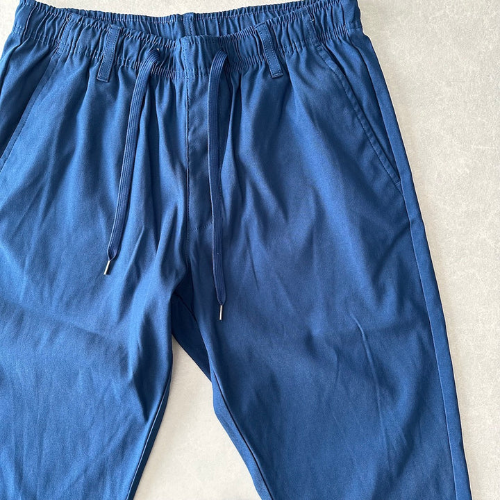 ストレッチイージーパンツ ブルー L 古着 メンズ